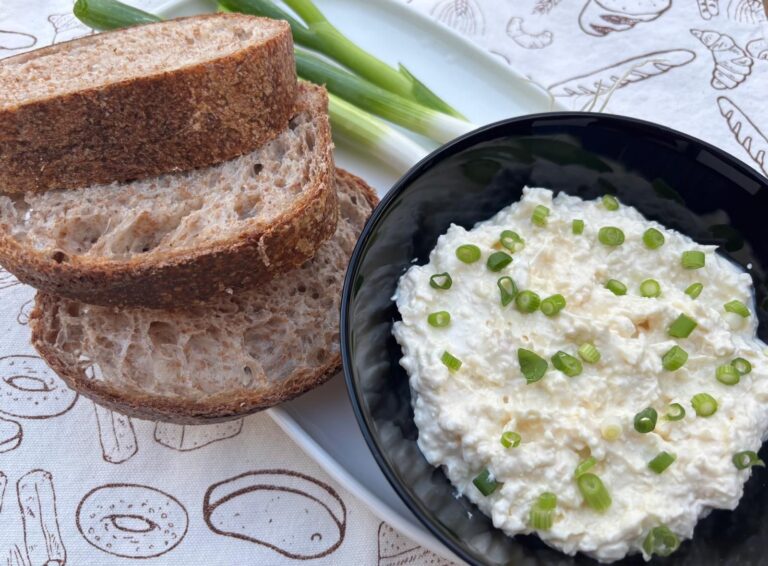 Creamy Oštiepok cheese spread with sourdough bread and spring onion