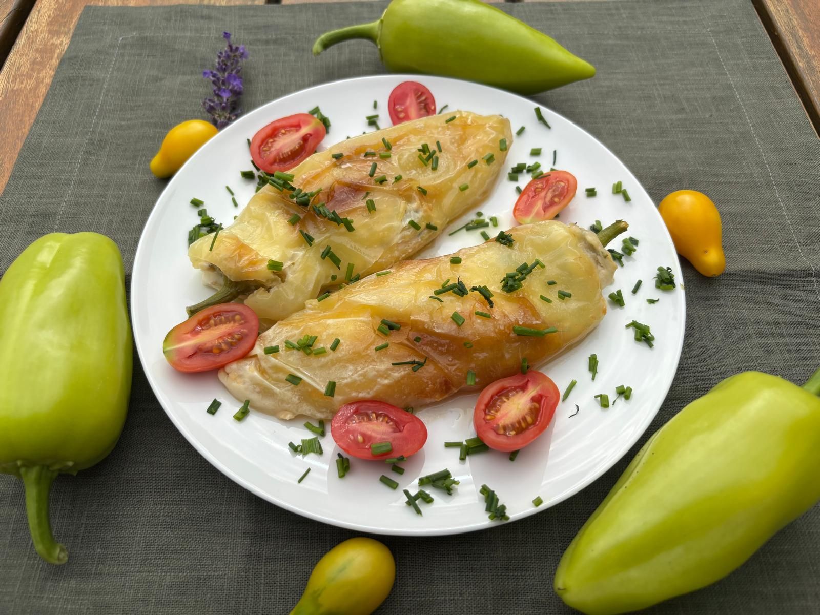 Pan-fried peppers stuffed with cheese, chives and tomatoes